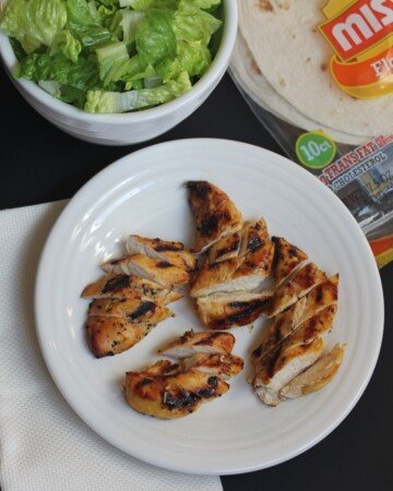 grilled honey mustard chicken on a plate with lettuce