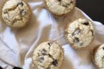 oatmeal muffins on white cloth and black counter