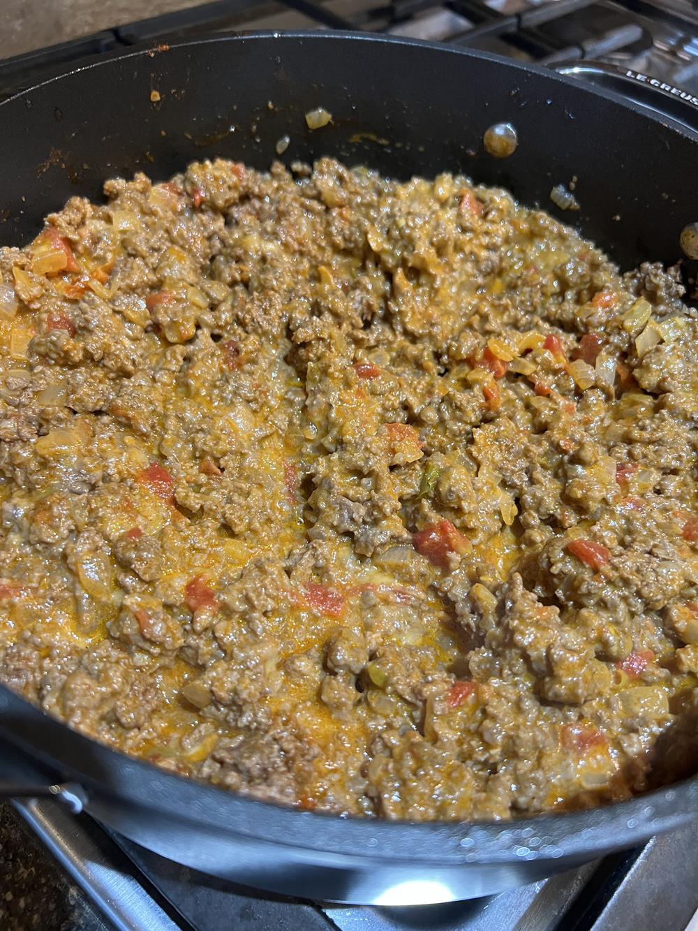 sloppy joes in a pan on a stove