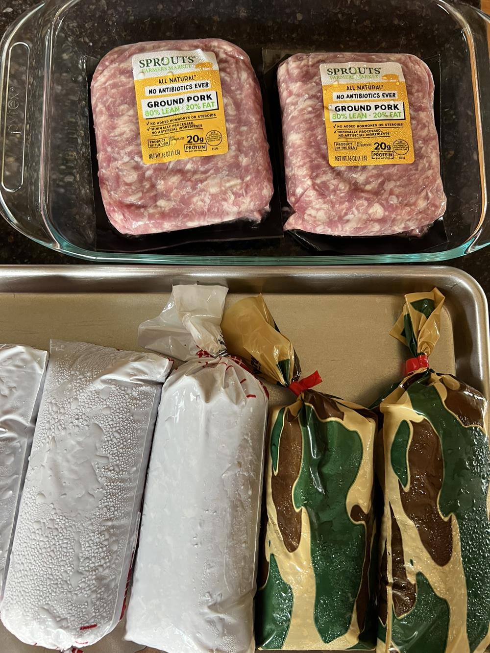 three different kinds of meat in packages