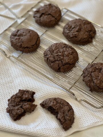 brownie cookies on cooling rack on white cloth