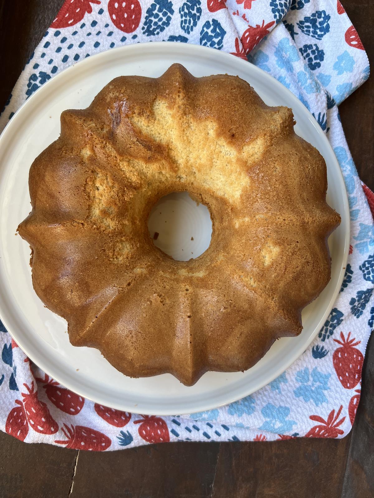 Gluten Free Cold Oven Pound cake on white platter with red white and blue napkin