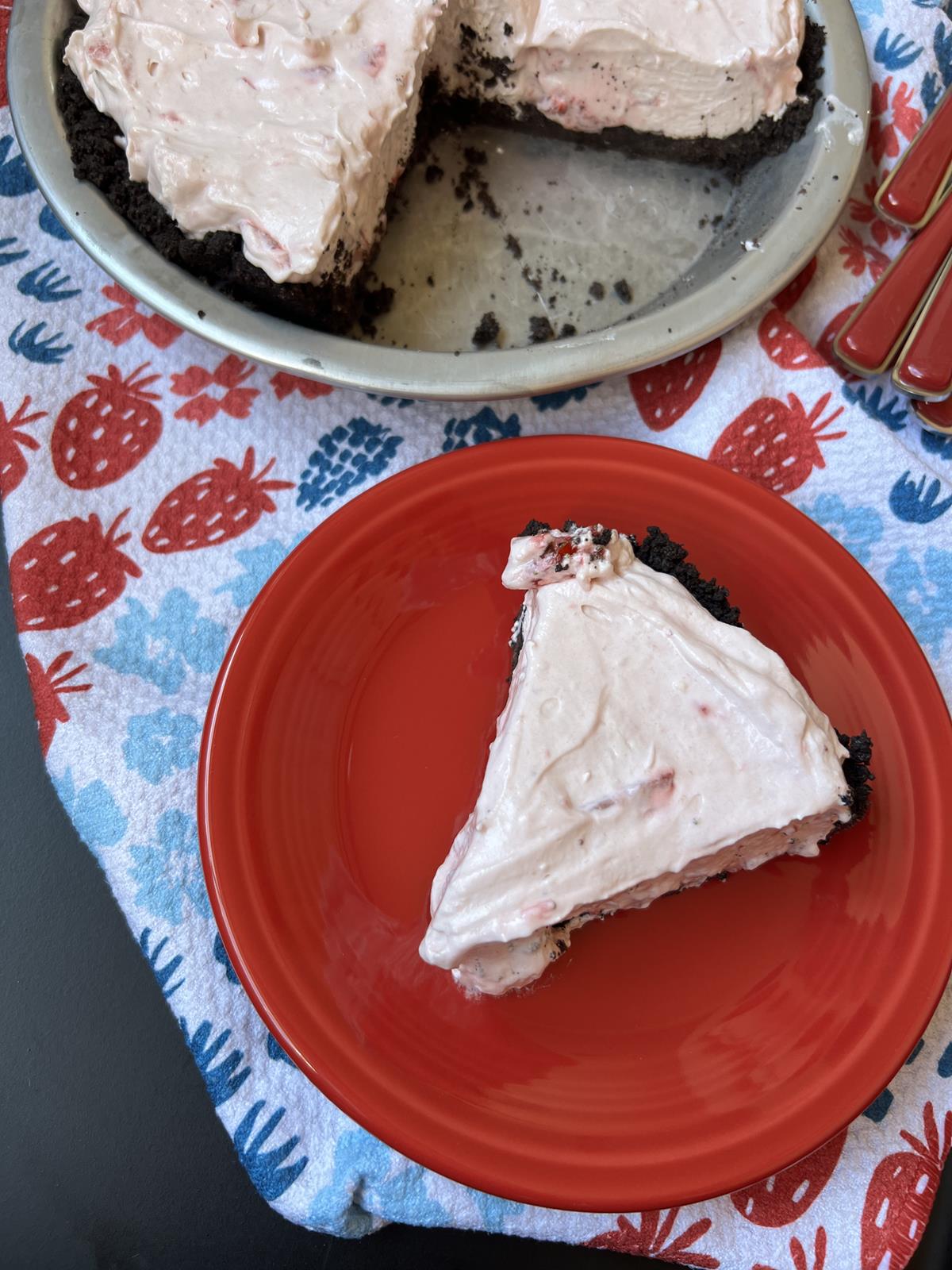 piece of No Bake Berry Pie on red plate on red white and blue napkin