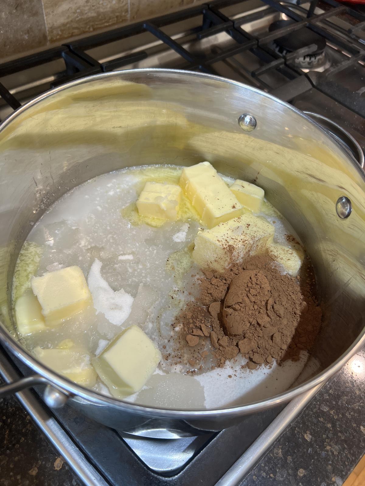 butter, sugar, and chocolate in pan on stove top