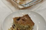 piece of gluten free blueberry coffee cake on white plate with white fork