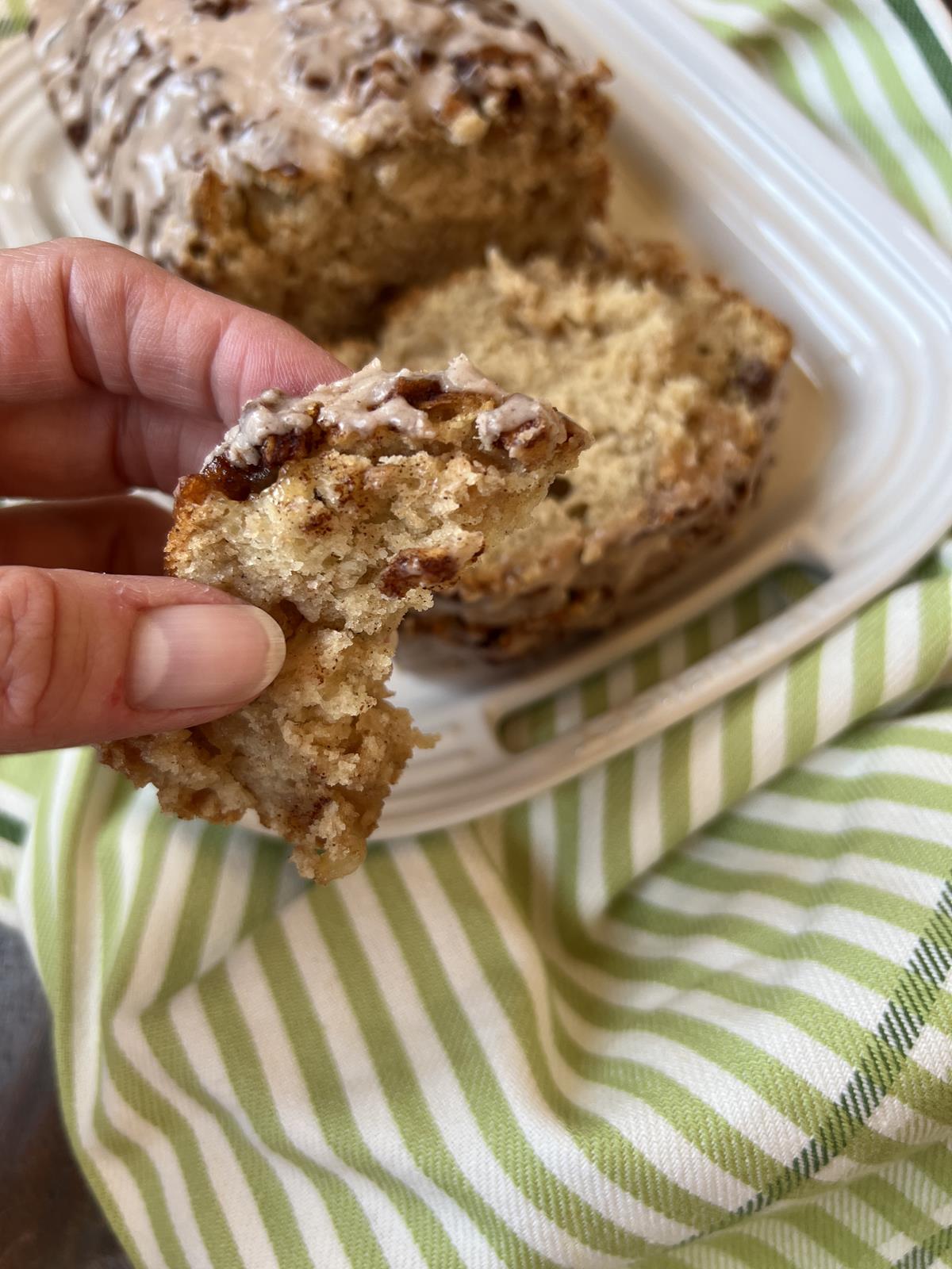 hand holding Gluten Free Apple Fritter Bread piece of bread