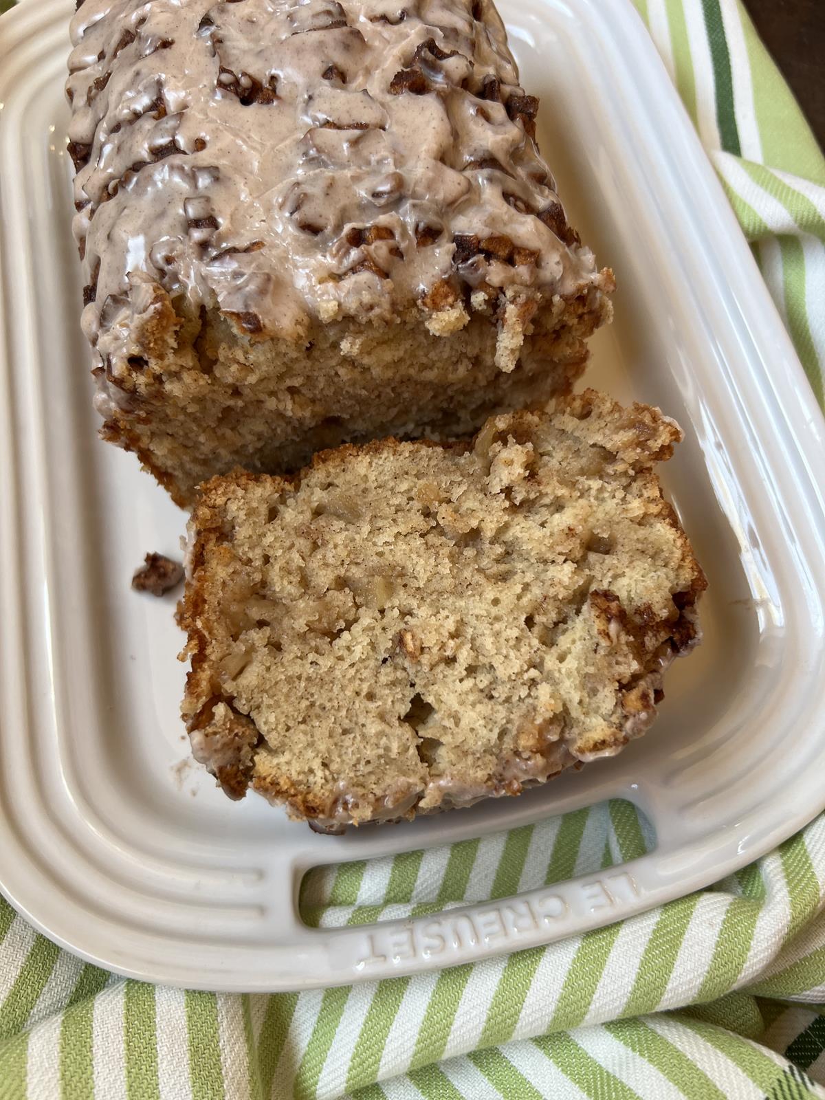 Gluten Free Apple Fritter Bread slice on white plate with green and white napkin