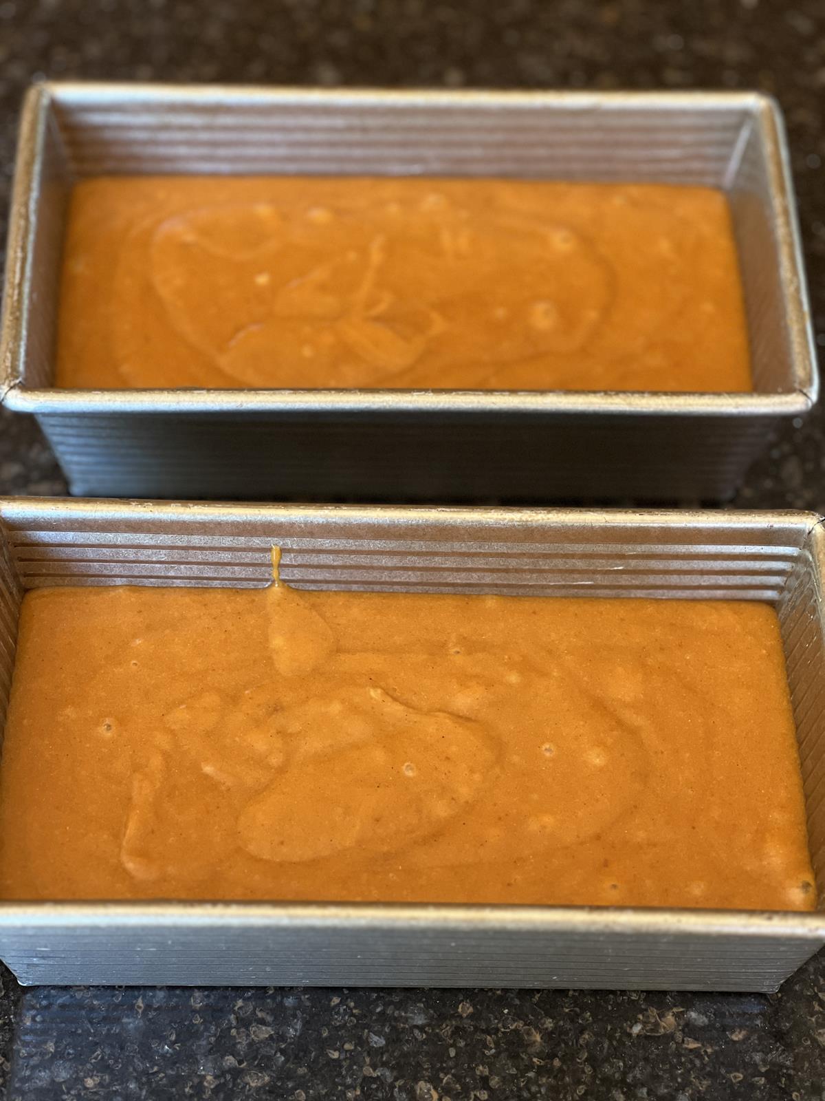 pumpkin bread batter in loaf pans