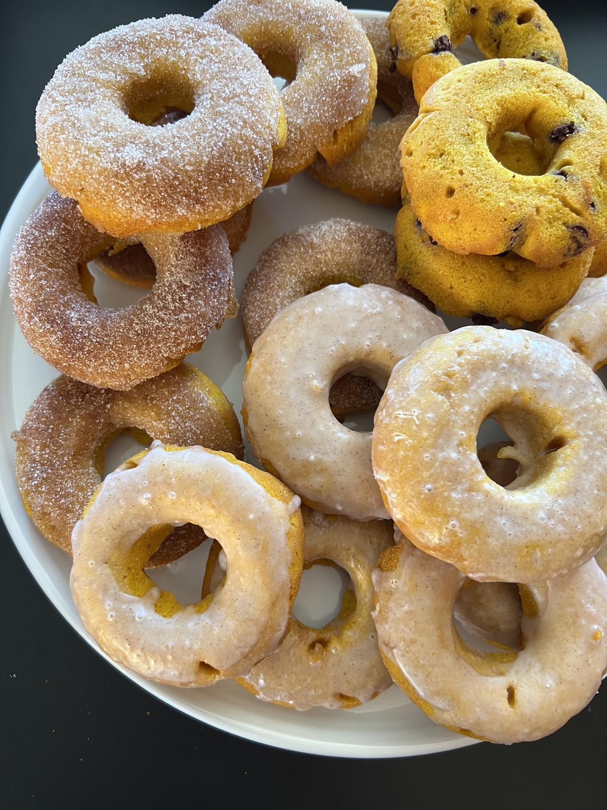 pumpkin doughnuts on white plate