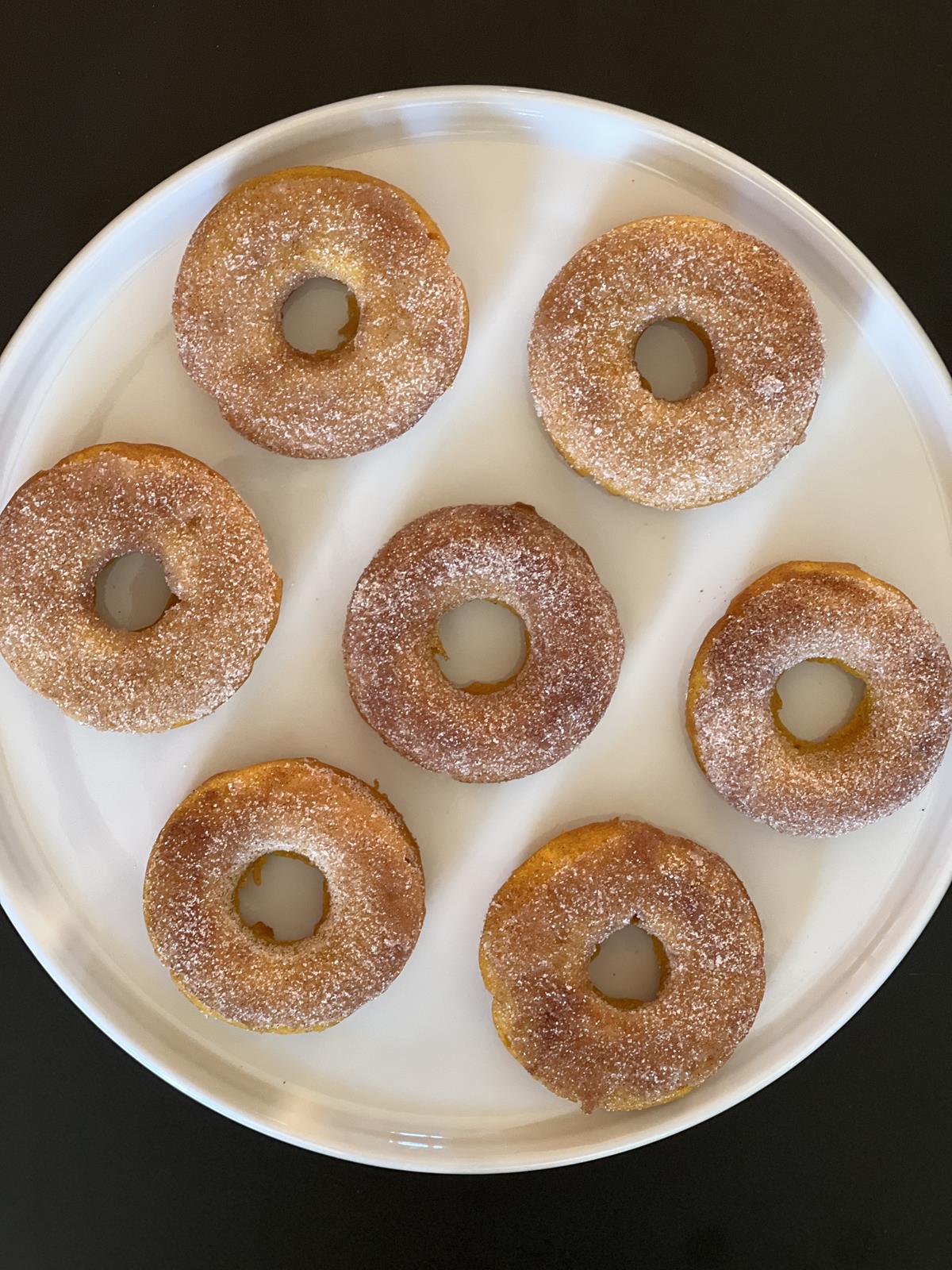 gluten free pumpkin doughnuts on white plate