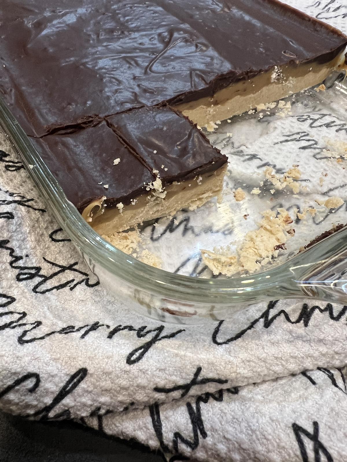 Chocolate Caramel Shortbread Bars in glass dish on Christmas napkin