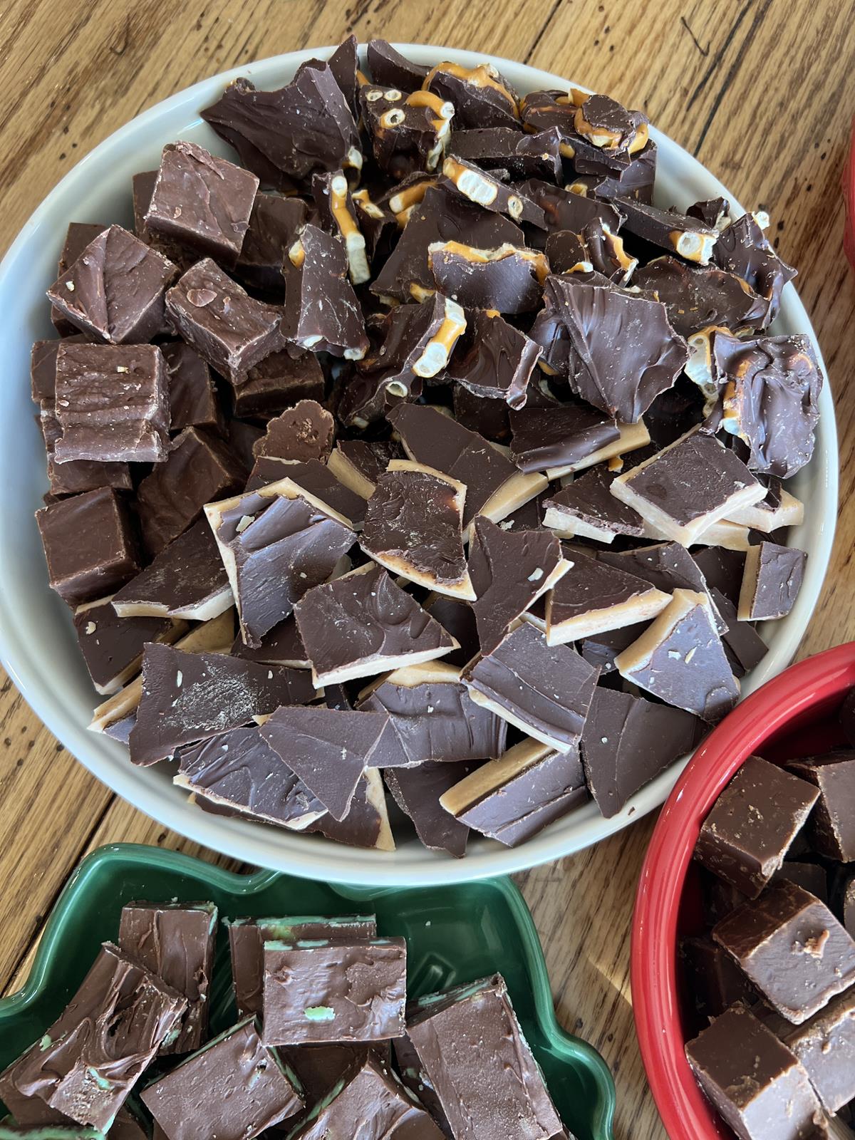 chocolate candy and fudge in white red and green plates