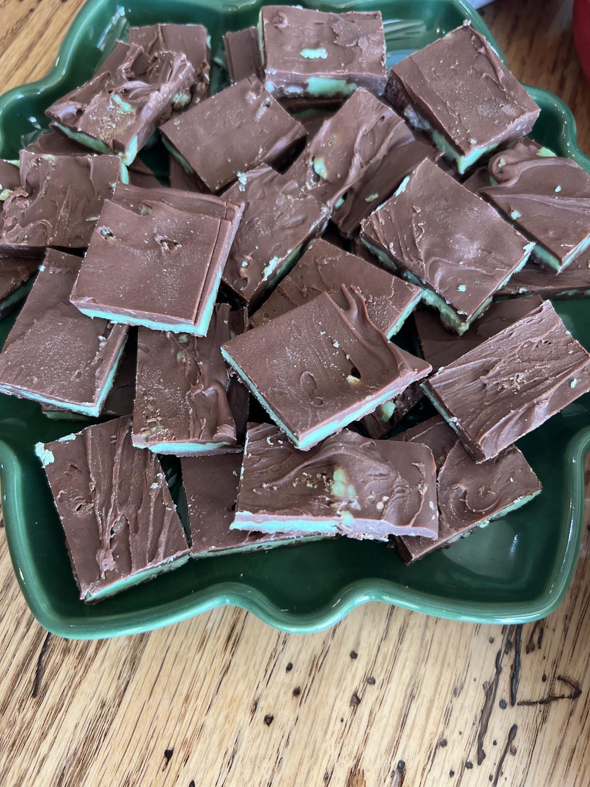 chocolate mint candies on green plate