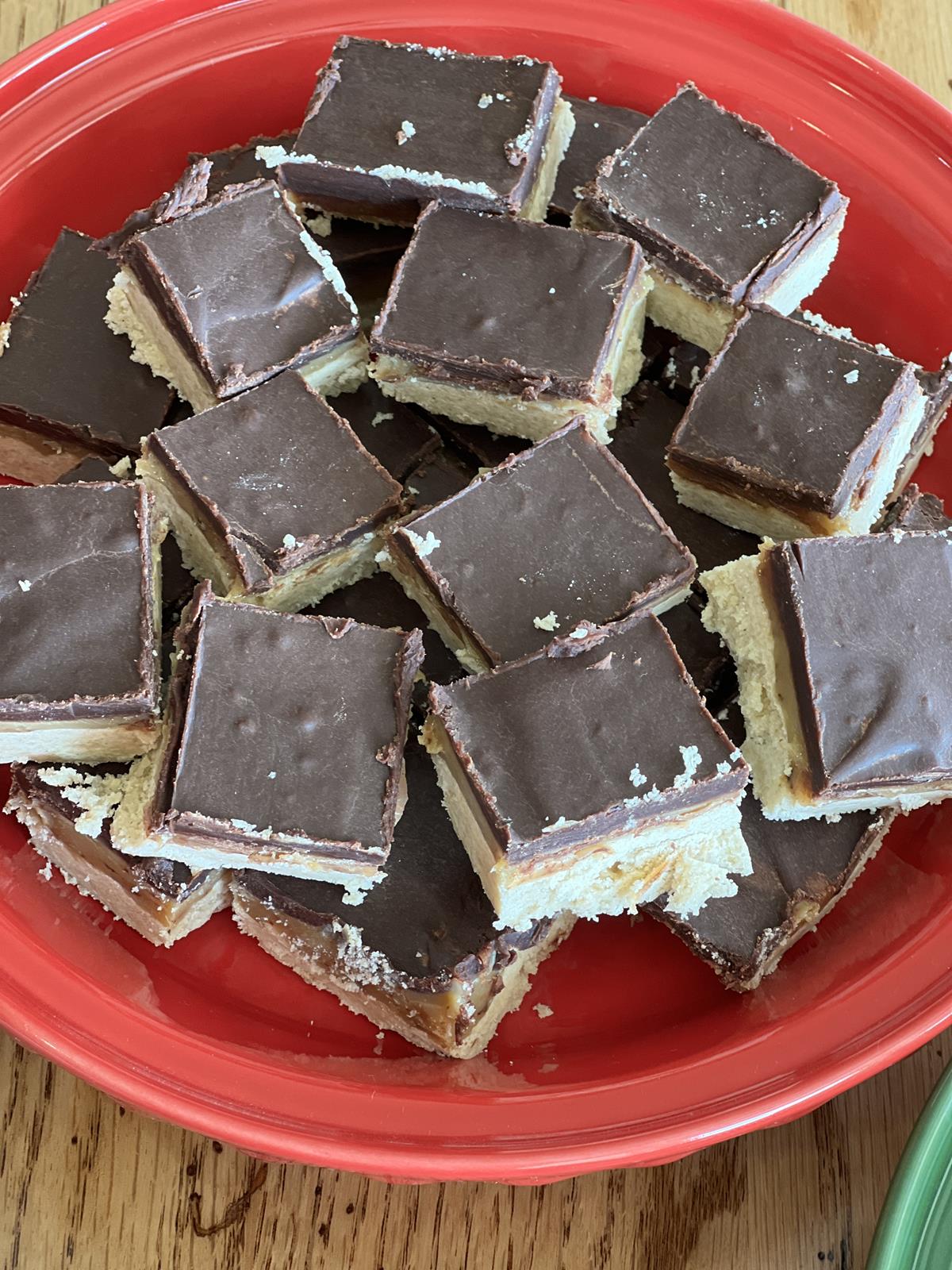 chocolate caramel shortbread cookies on red plate