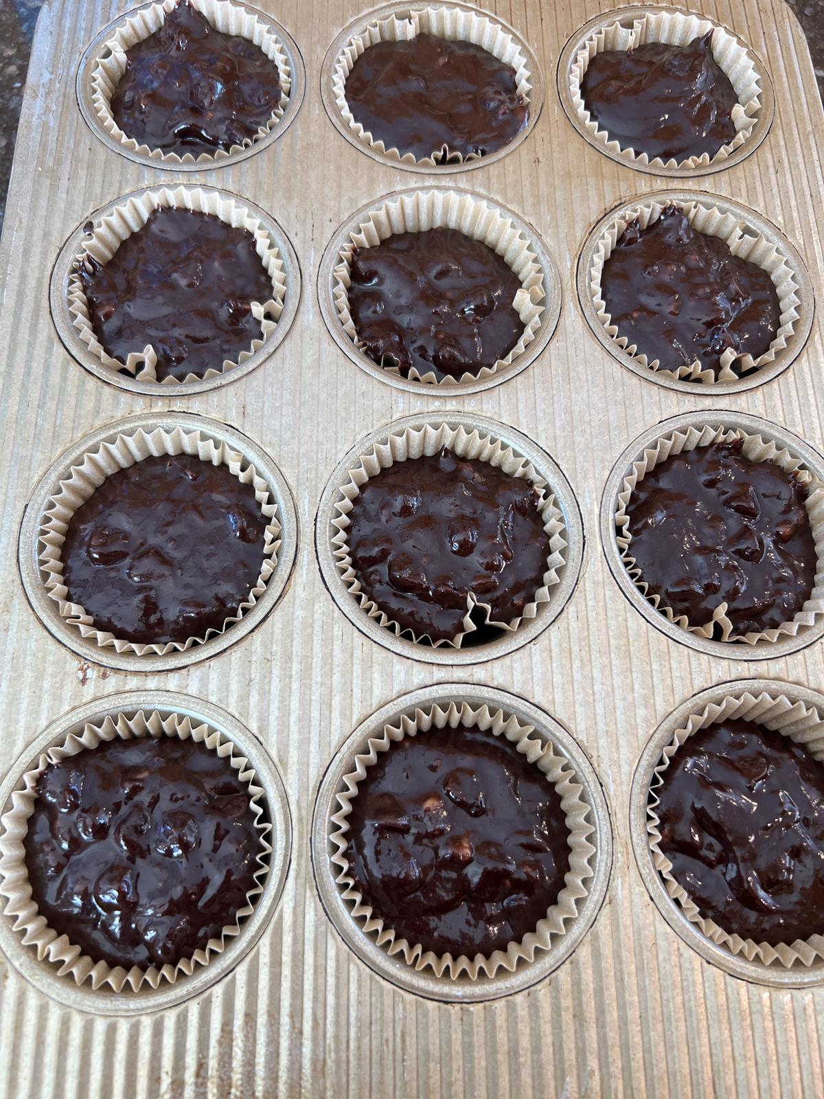 gluten free dairy free chocolate banana muffin batter in muffin pann