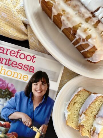 Barefoot Contessa cookbook and lemon yogurt cake on white plate