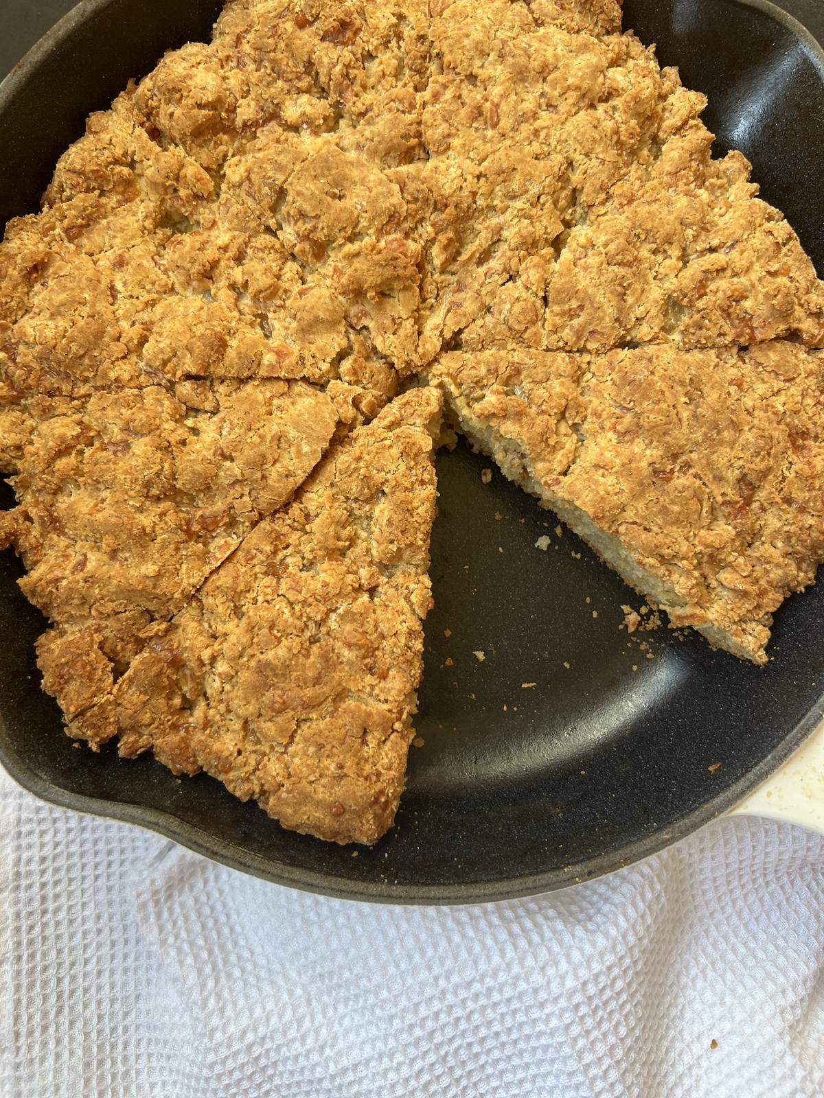 soda bread in cast iron pan on white napkin